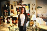 Photo of Heather Karlie Vieira in a room decorated with paintings, art, sculpture, furniture and lighting