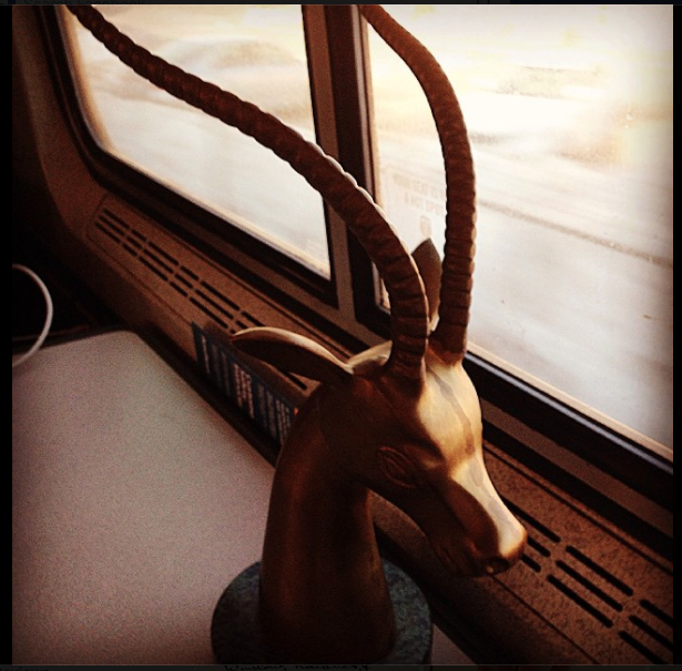 photo of a brass culpture on a train