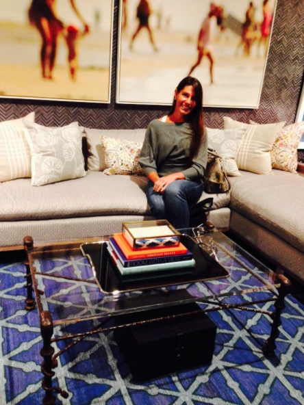 photo of heather karlie vieira of hkfa in the new york city showroom of thom filicia featuring a coffee table sourced by hkfa