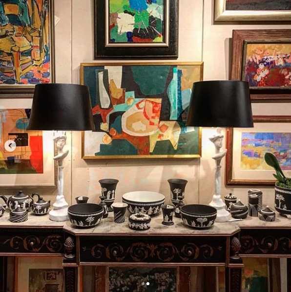 Photo of an interior design vignette featuring a mid century abstract painting sourced by Heather Karlie Vieira of HKFA