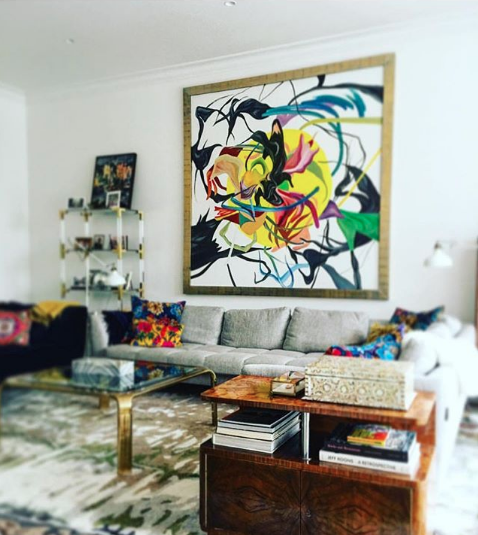 Photo of a vignette in an interior designed by New York City interior designer Justin Shaulis featuring an oversized double sided abstract painting sourced by Heather Karlie Vieira of HKFA