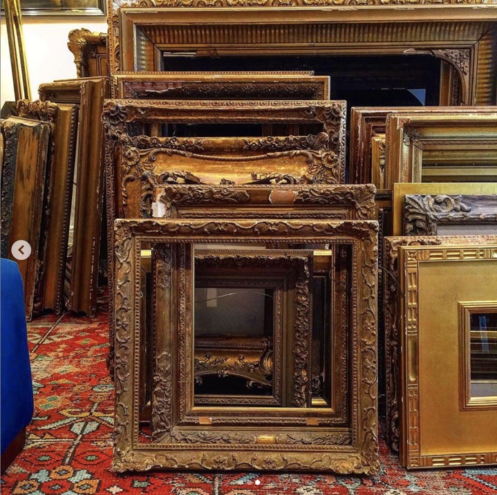 pile of antique frames sourced by heather karlie vieira of hkfa